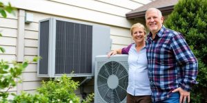 Home with clean HVAC unit and happy homeowner.