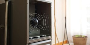Furnace with sound waves emanating from it.